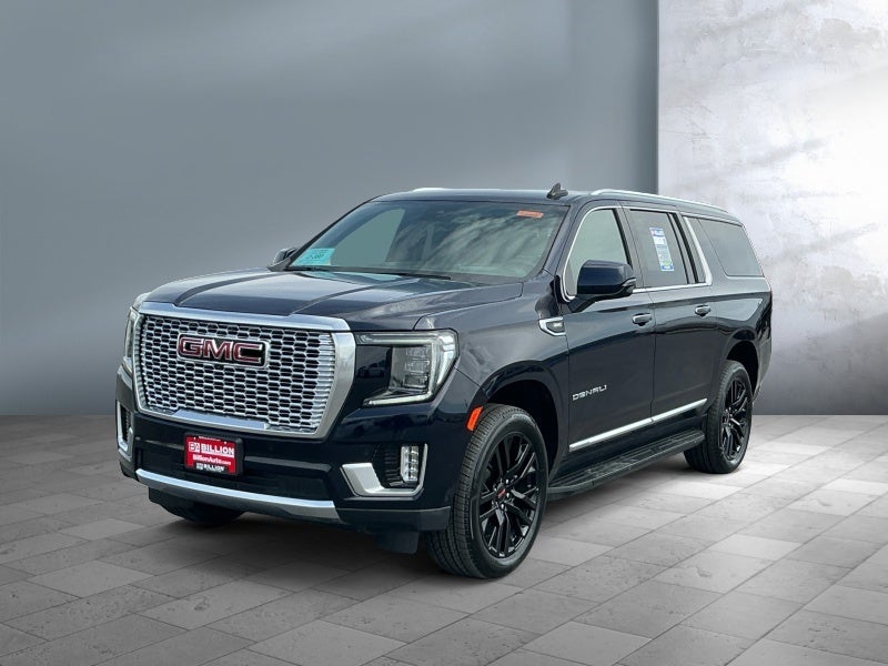 2024 GMC Yukon XL Denali in Midnight Blue Metallic — front three-quarter view