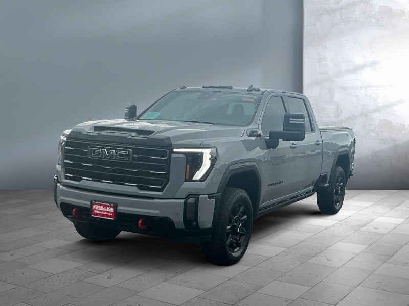 2024 GMC Sierra 2500 HD AT4 in Thunderstorm Gray — front three-quarter view