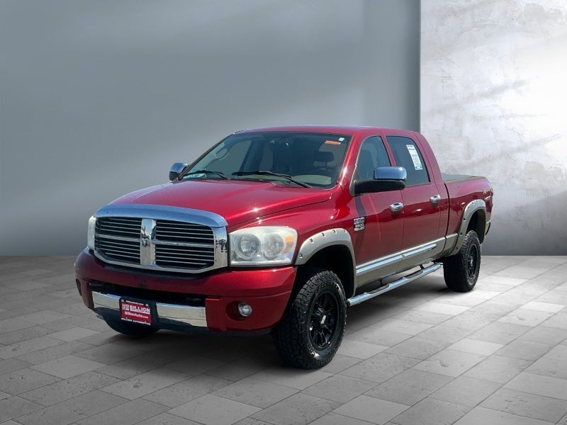 2009 Dodge Ram 3500 Laramie in Red — front three-quarter view