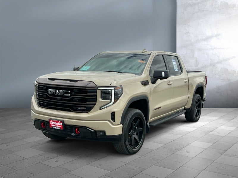 2023 GMC Sierra 1500 AT4X in Desert Sand Metallic — front three-quarter view